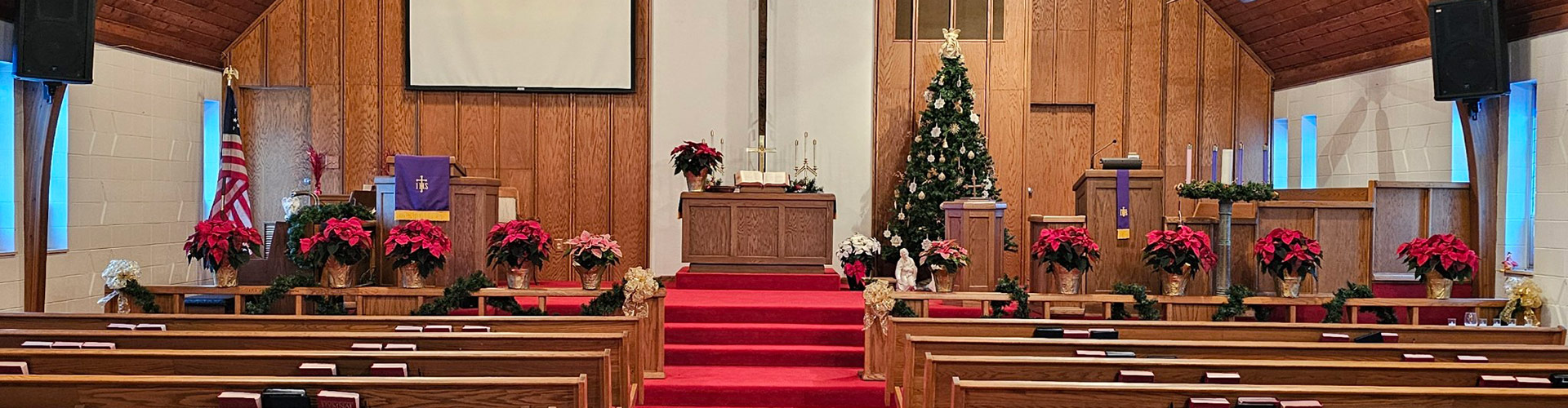 Wide angle showing the inside of the church decorated for Christmas